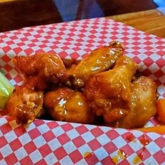 Deliciously cooked chicken wings with sauce of your choosing served by Social House of Rice Lake in Rice Lake WI.